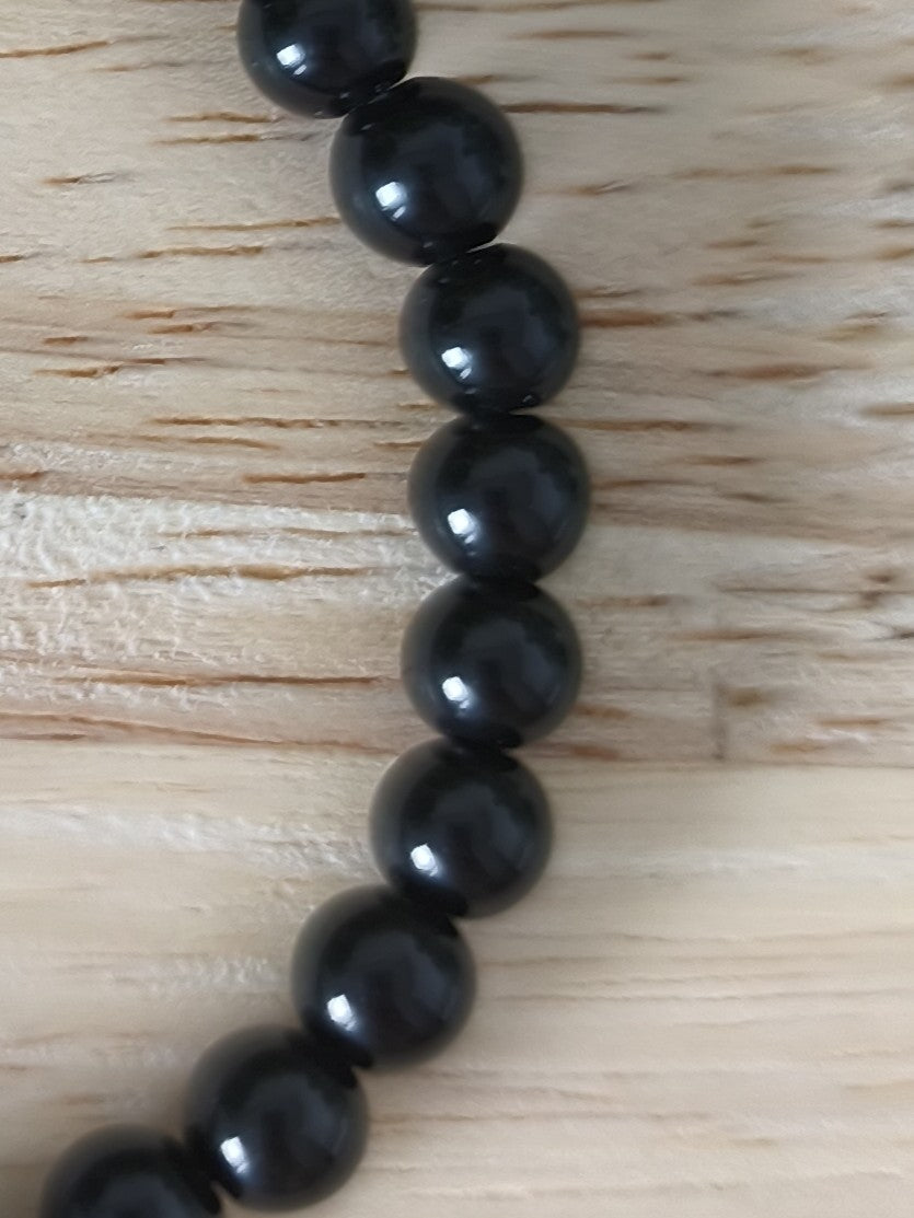 Bracelet Obsidienne Noire 6mm, pierres naturelles polies, Collection Pierre d’Exception, bijou noir protecteur et élégant.